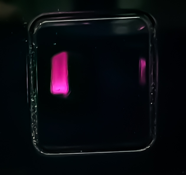 A close up of a glowing torch of a MP-AES system. The light is emitted during the analysis of samples.